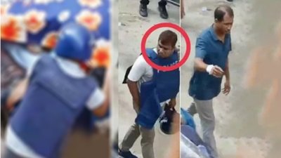 পুলিশের ভেস্ট এবং হেলমেট পরা এক ব্যক্তি নিথর দেহের এক যুবককে ভ্যানে তুলছেন (বাঁয়ে)। ভিডিওতে থাকা পুলিশ সদস্যদের মধ্যে একজনঢাকা উত্তর ডিবি পুলিশের পরিদর্শক আরাফাত (বৃত্ত চিহ্নিত)