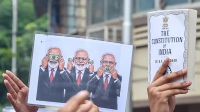 বিক্ষোভে প্রদর্শিত একটি পোস্টার। ছবি: ইপিএ