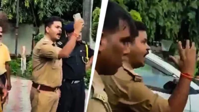 পুলিশের সাব-ইনস্পেক্টর অবিরল মিশ্রকে হাত উঁচিয়ে ও ঘুষি পাকিয়ে আক্রোশ প্রকাশ করতে দেখা যায়। ছবি: ইন্ডিয়া টুডে