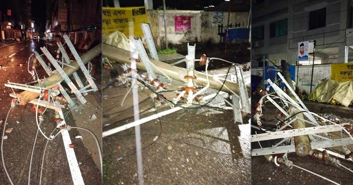 ঝোড়ো বাতাসে পল্লী বিদ্যুতের খুঁটি ভেঙে সড়কে