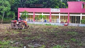 স্কুলমাঠ উপযোগী করতে ট্রাক্টর দিয়ে হাল-চাষ! 