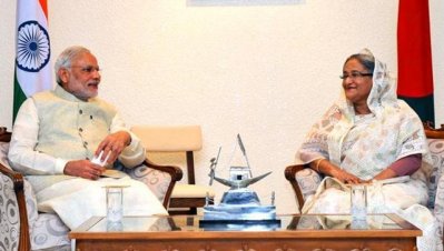 গত বছর ভারতীয় প্রধানমন্ত্রীর ঢাকা সফরকালে বাংলাদেশের প্রধানমন্ত্রী শেখ হাসিনার সঙ্গের বৈঠকের ছবি