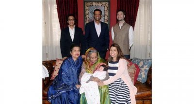 টিউলিপের সন্তানকে কোলে নিয়ে আদর করছেন প্রধানমন্ত্রী