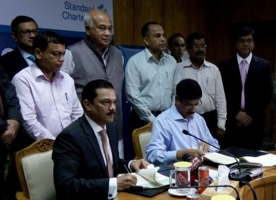 রাজউক ও স্ট্যান্ডার্ড চার্টার্ড ব্যাংকের মধ্যে সমঝোতা