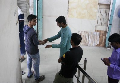 শ্রমিকদের কাছ থেকে টাকা নেওয়া হচ্ছে