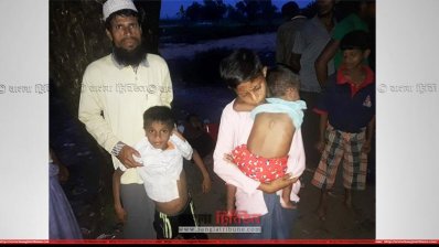 বাবার সঙ্গে মিয়ানমার থেকে পালিয়ে আসা রোহিঙ্গা শিশু
