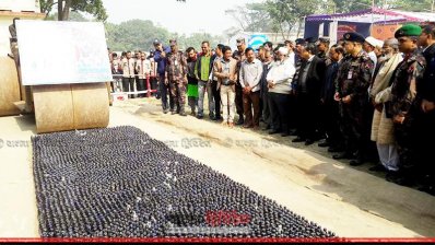 বুলডোজার দিয়ে গুঁড়িয়ে দেওয়া হচ্ছে ফেনসিডিলের বোতল