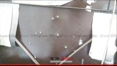 স্টিলের দরজায় গুলির ফলে সৃষ্ট ছিদ্র