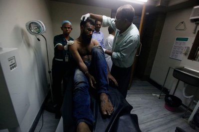 হামলায় আহত এপির ফটো সাংবাদিক এম এ আহাদ