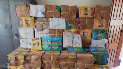 গুদামে বস্তাবন্দি ক্ষুদ্র নৃগোষ্ঠির মাতৃভাষার বই