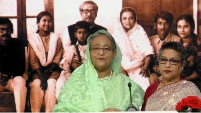 বঙ্গবন্ধুসহ পরিবারের সদস্যদের ছবির সামনে প্রধানমন্ত্রী শেখ হাসিনা ও শেখ রেহানা (ছবিটি স্ক্রিনশট থেকে নেওয়া)