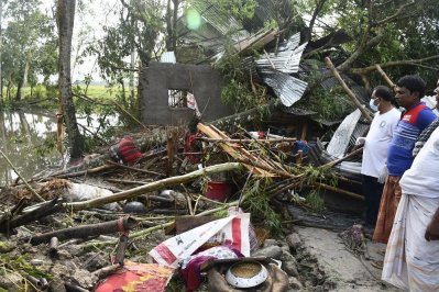 ঝড়ের আঘাতে ভেঙে পড়া ঘরবাড়ি