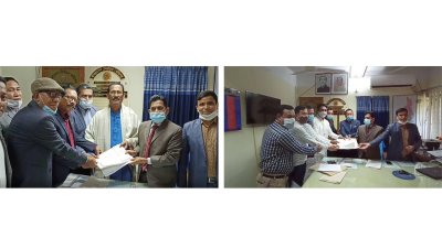 খাগড়াছড়ি পৌরসভা নির্বাচনে মনোনয়নপত্র জমা দিচ্ছেন (বামে) আওয়ামী লীগের প্রার্থী নির্মলেন্দু চৌধুরী ও (ডানে) বিএনপির প্রার্থী ইব্রাহিম খলিল।