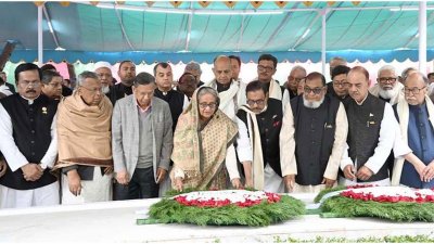 টুঙ্গিপাড়ায় বঙ্গবন্ধুর সমাধিতে পুষ্পস্তবক অর্পণ করছেন প্রধানমন্ত্রী ও মন্ত্রিসভার সদস্যরা