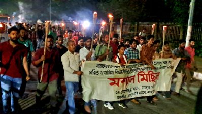 পিটিয়ে হত্যায় জড়িতদের বিচার দাবিতে মশাল মিছিল