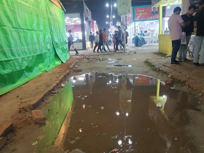 মেলা প্রাঙ্গণে জমা বৃষ্টির পানি