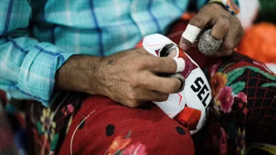 হাতে সেলাই করা হয় ফুটবল।