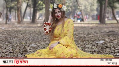 রাজধানীর সোহরাওয়ার্দী উদ্যানে বসন্তের সাজে এক তরুণী