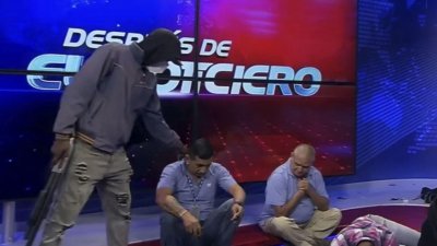 টেলিভিশনে লাইভ চলাকালীন বন্দুকধারীদের হামলা। ছবি: দ্য গার্ডিয়ান