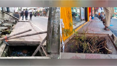 ম্যানহোলে বাঁশ এবং ডাল দিয়ে সতর্কসংকেত (ছবি: বাংলা ট্রিবিউন)