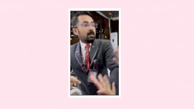 ভিডিও ফুটেজ থেকে নেওয়া ছবিতে হামলা করতে উদ্যত এয়ারলাইন্স কর্মী