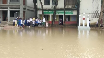 সামান্য বৃষ্টিতে বিদ্যালয়টির সামনের মাঠে পানি জমে যায়