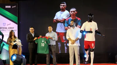 বাংলাদেশ দলের নতুন জার্সি হাতে বাফুফে সভাপতি তাবিথ আউয়াল।