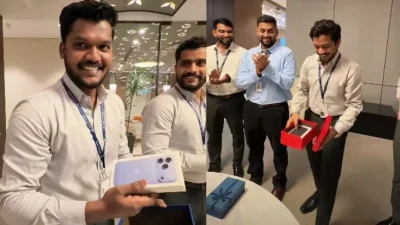 ব্র্যান্ড নিউ আইফোন পেয়ে উচ্ছ্বসিত অফিসের কর্মীরা। ছবি: সংগৃহীত